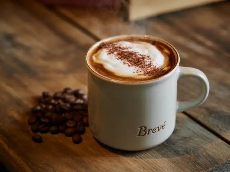 Breve Latte – The Best Creamy Coffee Upgrade You Need to Try Today 6 Hot breve latte in ceramic mug on wooden table